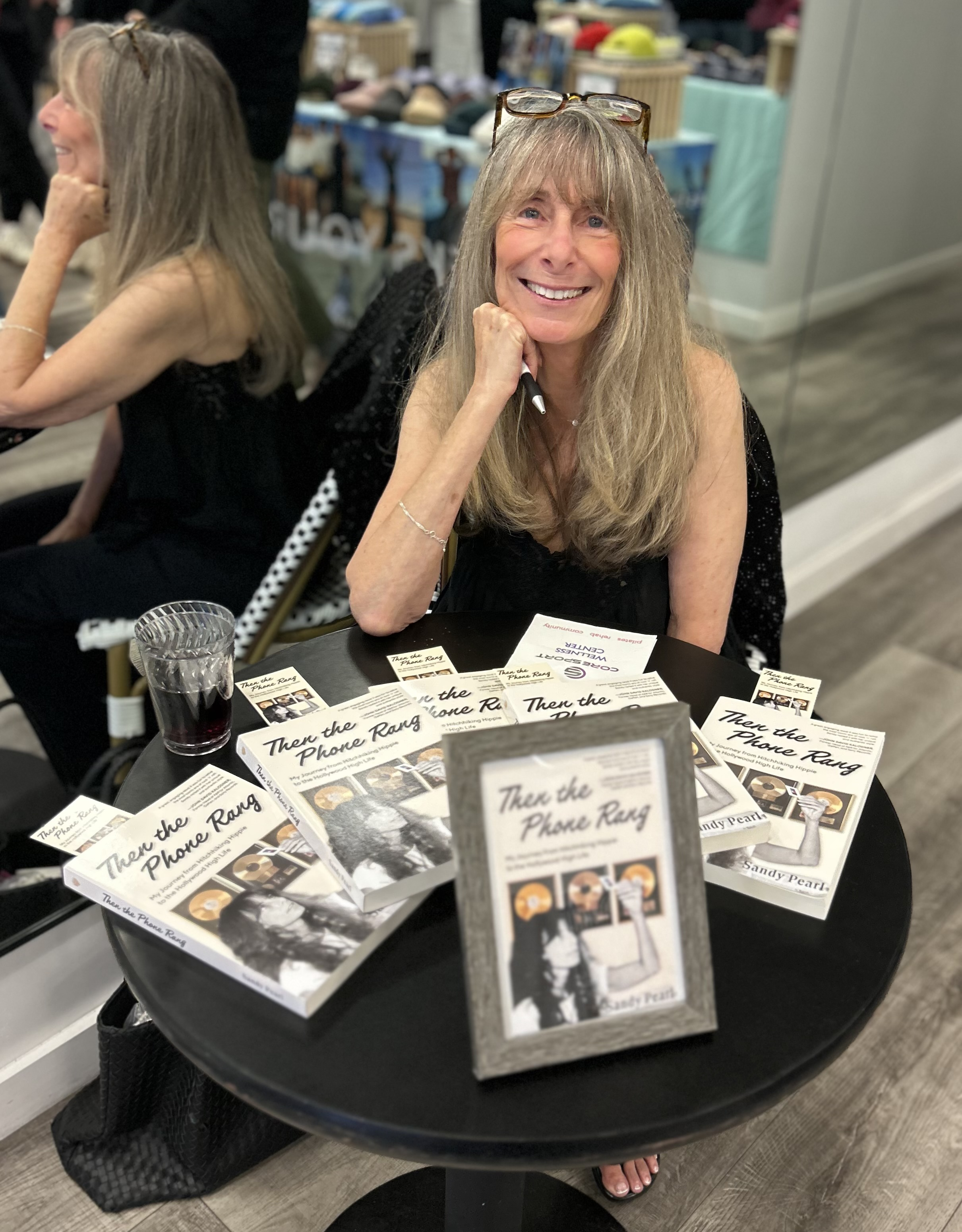 Sandy Pearl signing books at the CoreSport Christmas Party