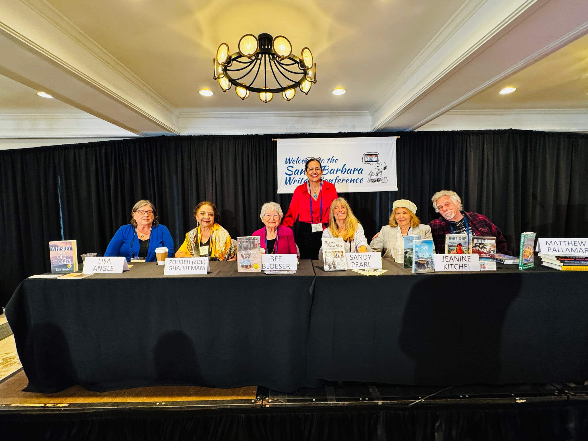 Panel authors seated at the 2026 Santa Barbara Writers Conference — Lisa Angle, Zohreh (Zoe) Ghahremani, Bee Bloeser, Sandy Pearl, Jeanine Kitchel, and Matthew Pallamary, with Rachel Sarah Thurston